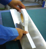 Apply the tape and press it with a finger or a roller to set it firmly in place.